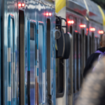 A light rail car‘s exterior panels and lights​ Keywords: human-built abstracts, detail, sustainable, sustainability; architecture; architectural; California; transportation; transport; city; urban; commute; innovation; electric; clean energy; clean air; infrastructure​